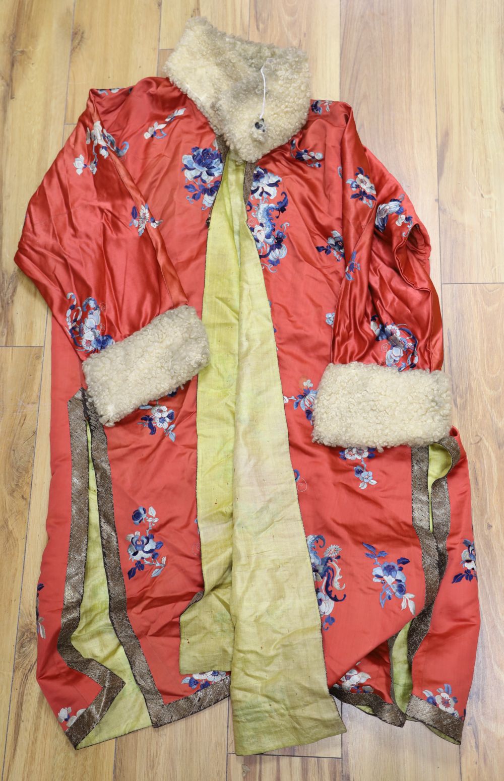 A red silk blue embroidered Chinese robe, with fur collar and cuffs added later, 110cm